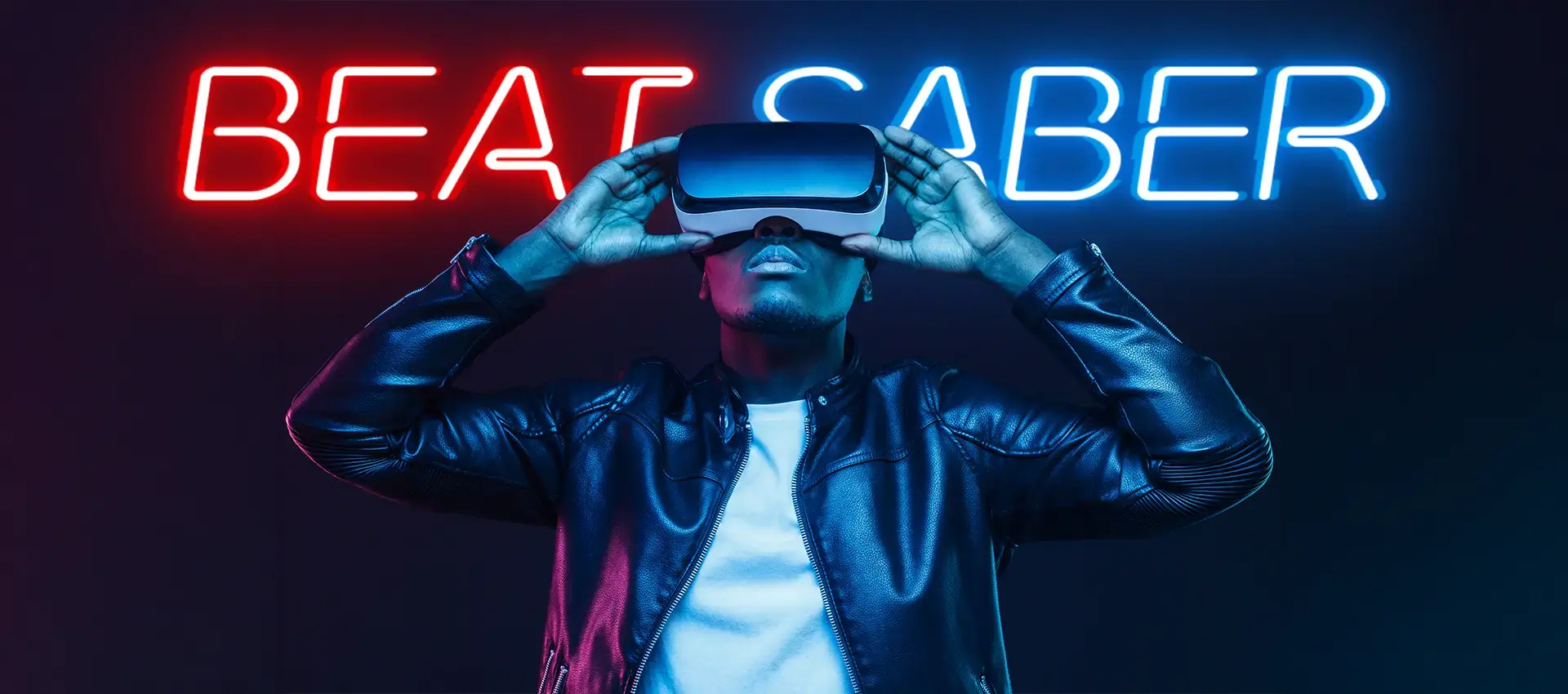 Person in a VR headset under red and blue Beat Saber neon